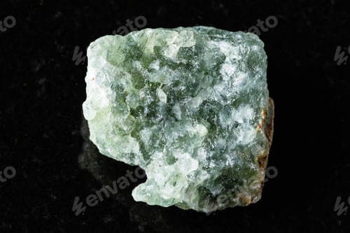 Preview: sample of uncut green aventurine mineral on black