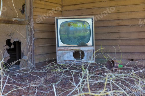Preview: Old TV set on front porch of an abandoned homestead.