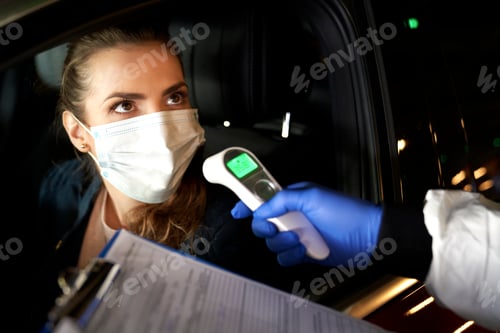 Preview: Close up of checking the temperature of woman