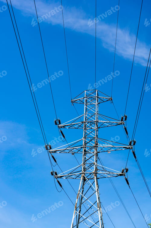 Preview: Low angle shot of the overhead power line on a clear blue sky background