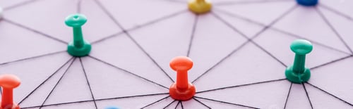 Preview: panoramic shot of push pins connected with strings Isolated On pink, network concept