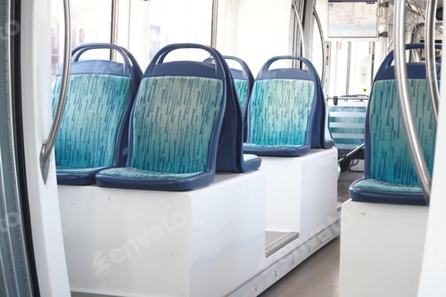 Preview: Empty public transport interior with blue and green seating
