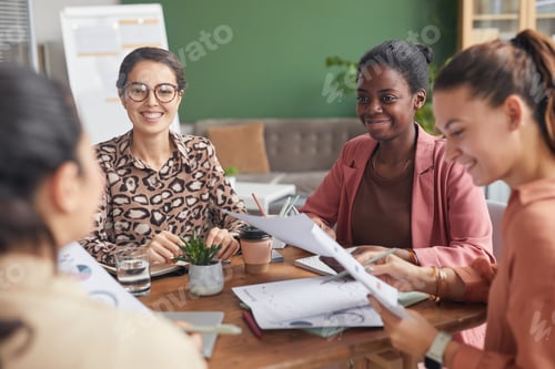 Preview: Team of Cheerful Female Entrepreneurs in Meeting