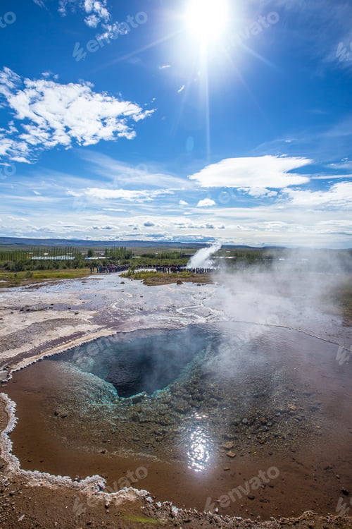 Preview: Geysir Strokkur with the sun in the background of the golden circle