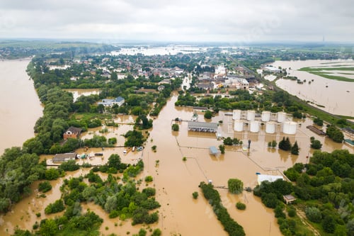 Preview: Aerial view of flooded houses with dirty water of Dnister river in Halych town, western Ukraine
