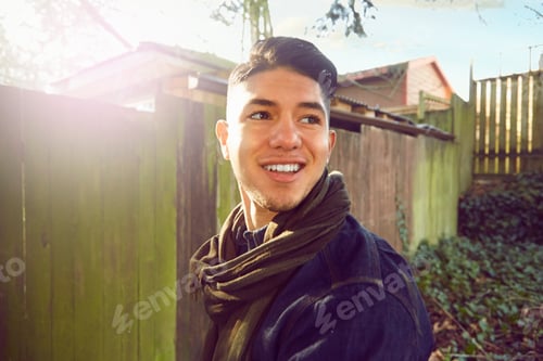 Preview: Young man with quiff looking away, smiling