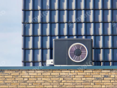 Preview: air source heat pump unit installed outdoors at a modern home with bricks in the Netherlands