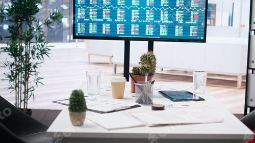 Preview: Stock exchange indices on screen in empty financial department office