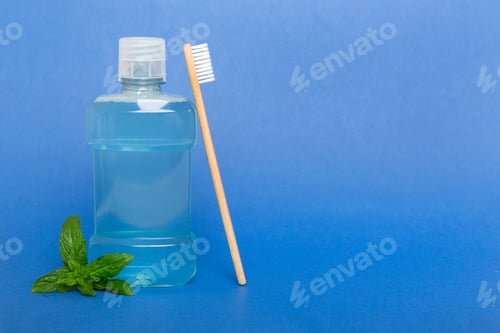 Preview: Mouthwash and fresh mint on colored background, top view with copy space for text