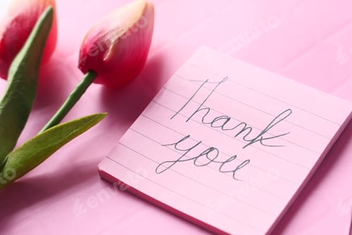 Preview: thank you message on sticky note with tulip flower on pink background