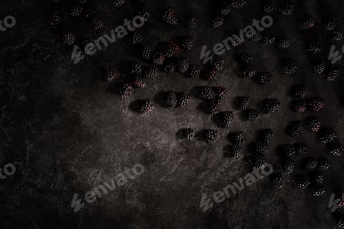Preview: top view of fresh ripe blackberries on black scratched background