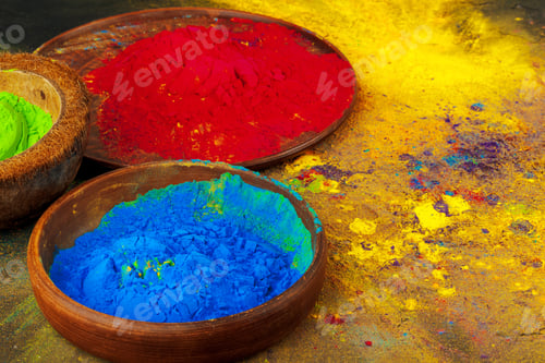 Preview: Indian Holi festival colours in small bowls on dark background