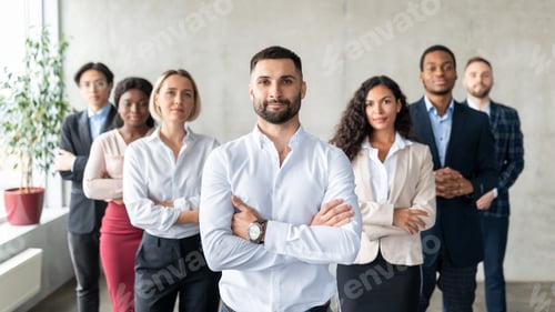 Preview: Arab Businessman Standing In Front Of Multiracial Business Team Indoor