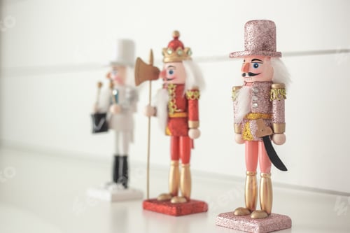 Preview: Red pink white and gold glittery nutcracker on a white background