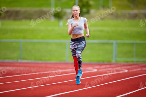 Preview: Woman In Sportswear Running On Sports Track