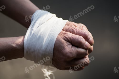Preview: Hands of a middle-aged woman on a blurred background