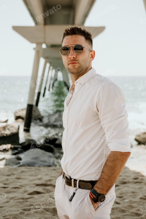 Preview: Travel vacation holiday concept.Handsome happy man wearing white shirt and sunglasses