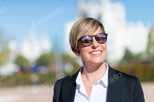 Preview: Outdoor portrait of a beautiful lady on the street wearing forma