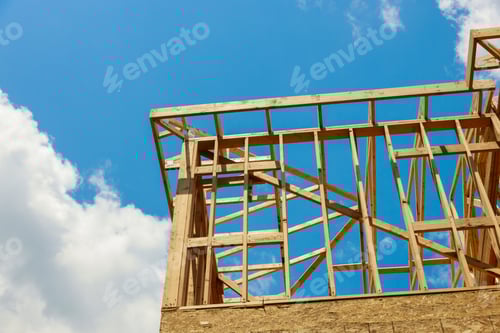 Preview: Wooden Building Frame Against a Bright Blue Sky