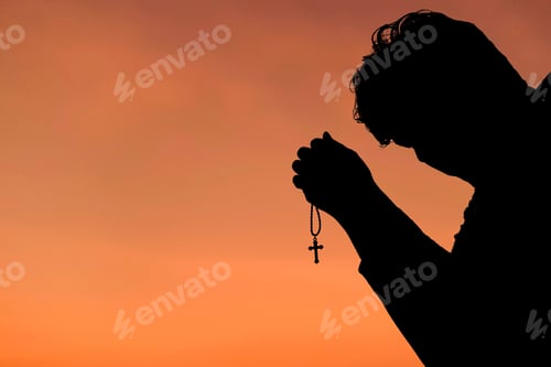 Preview: silhouette man praying hand for blessings When the sun goes down Hope for a happy life