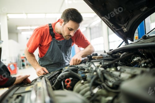 Preview: Auto mechanic working in garage. Repair service