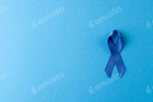 Preview: Composition of blue ribbon for prostate cancer awareness, on blue background with copy space