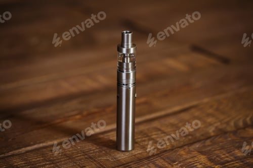 Preview: Electronic cigarette on a wooden table. Smoke
