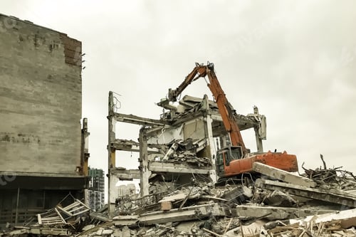 Preview: Hydraulic excavator demolition an old building at cloudy sky background