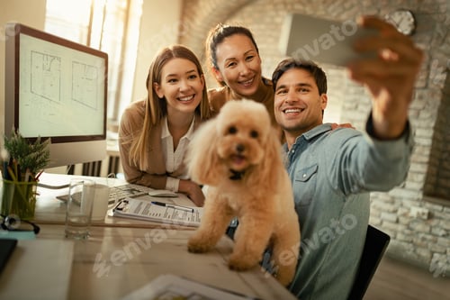 Preview: Group of happy colleagues taking selfie with a dog in the office.