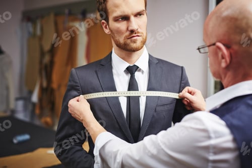 Preview: Man Getting Measured for Suit by Tailor
