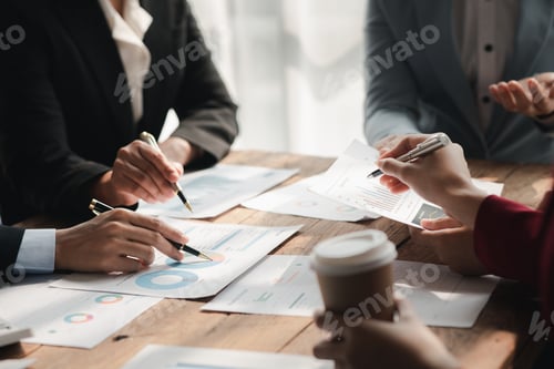 Preview: Businessman is reviewing monthly sales documents for analysis and marketing plans for more sales gro