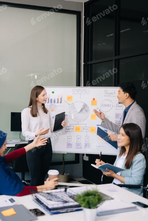 Preview: Creative business people working on business project in office