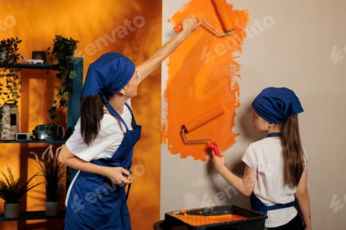 Preview: Family having fun with orange paint