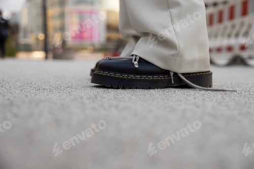 Preview: Closeup of cool trendy black boots with abstract lace design