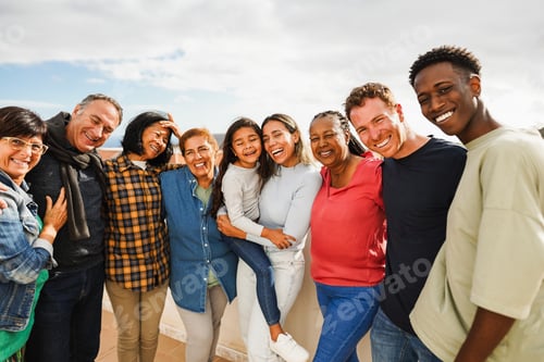 Preview: Group of multigenerational friends smiling in front of camera