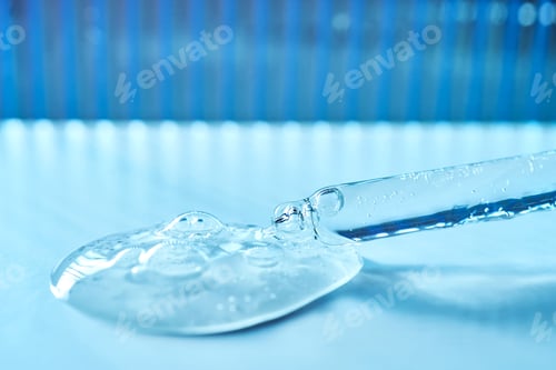 Preview: Serum in a pipette on a blue ribbed background.