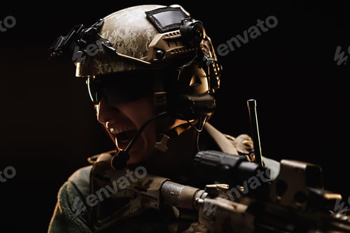 Preview: US special forces soldier looking at the aim ready to shoot against black dark background
