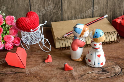 Preview: Lovely kissing couple on wooden background, Valentines day