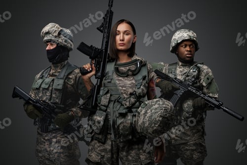 Preview: Tattooed female soldier with rifle near her two comrades