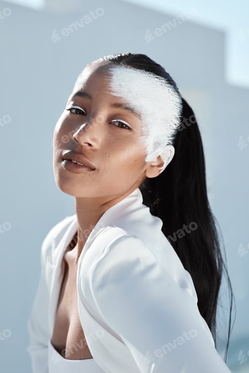 Preview: Shot of a beautiful young woman wearing creative make-up and stylish white clothes