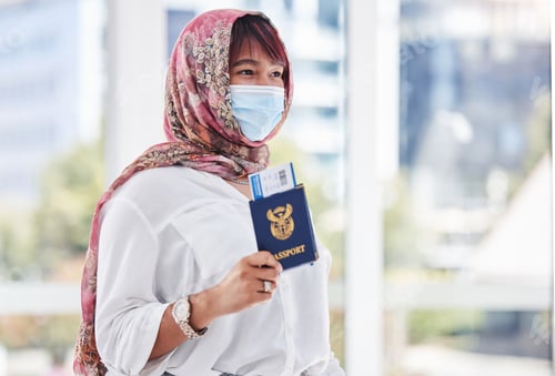 Preview: Travel, immigration and refugee woman with passport, mask and hijab at customs with ticket. Covid r