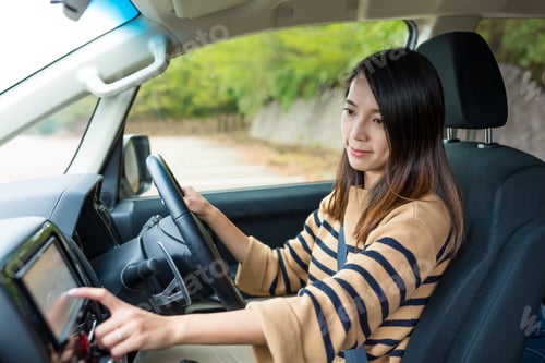 Preview: Woman driving a car