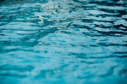 Preview: surface of blue swimming pool,background of water in swimming pool.