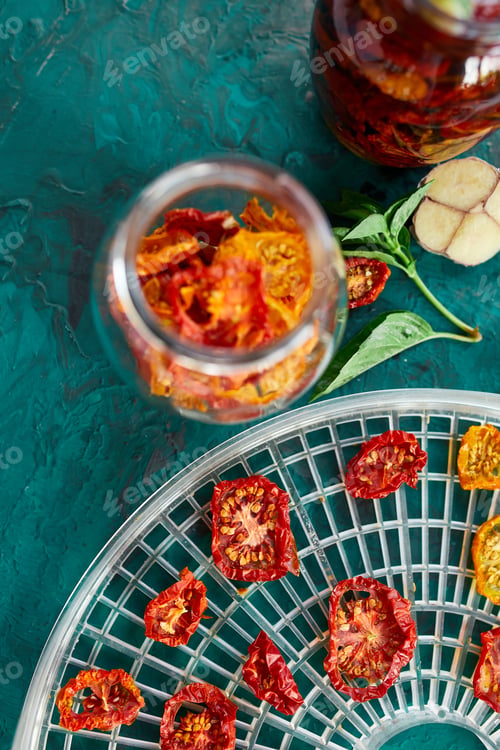 Preview: Homemade sun dried tomatoes with herbs, garlic in olive oil in a glass jar