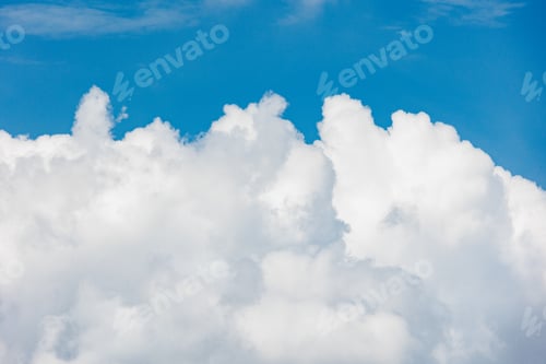 Preview: white cumulus clouds against a blue sky, beautiful large thunderclouds in the sky