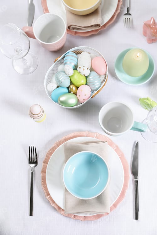 Preview: Festive table setting with painted eggs, flat lay. Easter celebration