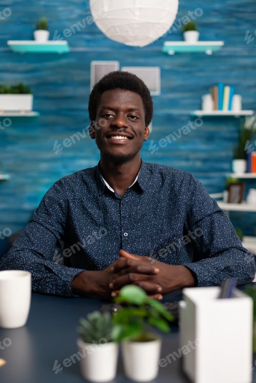 Preview: Portrait of african american student smiling while looking into camera