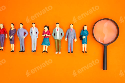Preview: miniature people and magnifying glass.