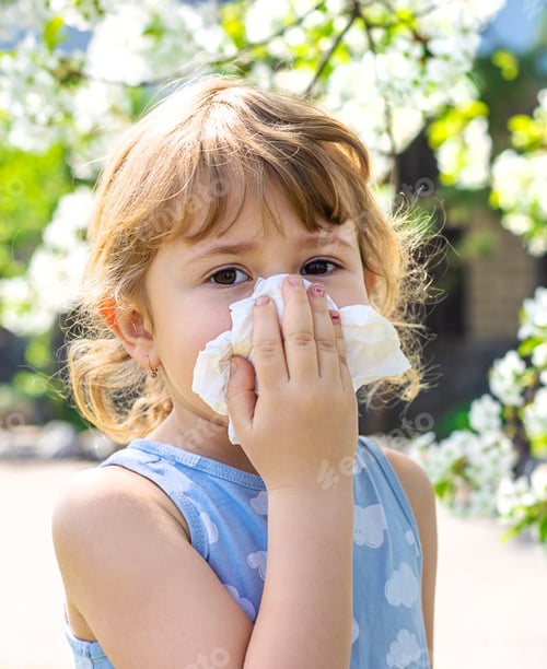 Preview: child allergic to flowering trees. Selective focus.