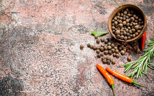 Preview: Pepper peas in a bowl with orange pepper and rosemary.